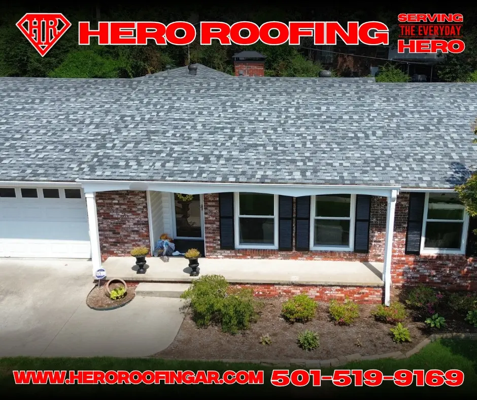 Patterned asphalt shingle roof on a brick house